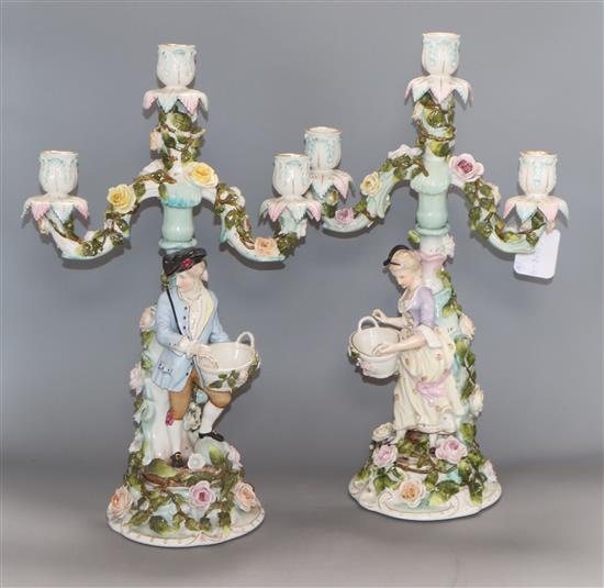 A pair of Sitzendorf figural three branch candelabra height 43cm